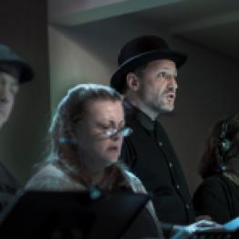 Actors Bryan Mitchell, Jeanne Ragonese, Jörg Witzsch and Cindy Halbert-Seger in a scene from the radio play “Sorry Wrong Number” by playwright Lucille Fletcher. Photo: Uka Meissner-DeRuiz